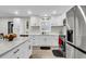 Updated kitchen with white cabinets, granite island, and stainless steel appliances at 127 Roberts Rd, Summerville, SC 29483