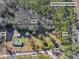 Aerial view of property showing home, detached garage, and pond at 151 Powerhouse Rd, Ridgeville, SC 29472