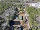 Aerial view of property showing home, detached garage, and pond at 151 Powerhouse Rd, Ridgeville, SC 29472