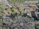Aerial view of property showing home, detached garage, and pond at 151 Powerhouse Rd, Ridgeville, SC 29472