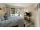 Main bedroom with a king-size bed, sliding doors to patio, and coastal decor at 162 High Hammock Villas, Seabrook Island, SC 29455