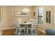 Small dining area with round table, four chairs, and a window at 162 High Hammock Villas, Seabrook Island, SC 29455