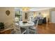 Dining area with round table and chairs, view into living room at 162 High Hammock Villas, Seabrook Island, SC 29455