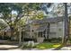 Exterior view of a two-story building with landscaping at 162 High Hammock Villas, Seabrook Island, SC 29455