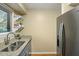 Updated kitchen with granite counters, stainless steel sink, and modern appliances at 162 High Hammock Villas, Seabrook Island, SC 29455