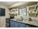 Kitchen with granite countertops, stainless steel appliances, and open shelving at 162 High Hammock Villas, Seabrook Island, SC 29455