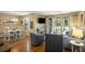 Living room features hardwood floors, comfy seating, and access to a patio at 162 High Hammock Villas, Seabrook Island, SC 29455