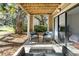 Relaxing patio with seating area, perfect for outdoor enjoyment at 162 High Hammock Villas, Seabrook Island, SC 29455