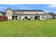 Spacious backyard with townhomes and green lawn at 162 Kirkland St, Goose Creek, SC 29445