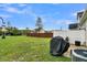 Fenced backyard with grassy area and grill at 162 Kirkland St, Goose Creek, SC 29445
