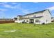 Large backyard, grassy area, and townhome view at 162 Kirkland St, Goose Creek, SC 29445