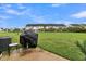 Spacious backyard with grassy area, patio, and grill at 162 Kirkland St, Goose Creek, SC 29445