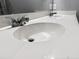 Close-up of bathroom double sinks with white countertop and chrome faucets at 162 Kirkland St, Goose Creek, SC 29445