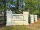 The Cokers Common community entrance framed by trees and painted brick pillars at 162 Kirkland St, Goose Creek, SC 29445