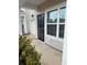 Inviting front entrance featuring a black front door, large window and neutral siding at 162 Kirkland St, Goose Creek, SC 29445