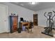 Home office or den with a desk, elliptical, and wood cabinet at 162 Kirkland St, Goose Creek, SC 29445