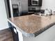 Kitchen island features a granite countertop, stainless steel sink and modern faucet at 162 Kirkland St, Goose Creek, SC 29445