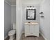 Clean bathroom with a white toilet and updated vanity at 2002 Valnore Rd, Johns Island, SC 29455