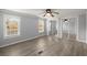Spacious bedroom with wood-look floors and mirrored closet doors at 2002 Valnore Rd, Johns Island, SC 29455