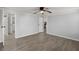 Bright bedroom with wood-look floors and access to the bathroom and laundry at 2002 Valnore Rd, Johns Island, SC 29455