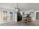 Open concept kitchen with island and French doors at 2002 Valnore Rd, Johns Island, SC 29455