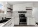 Updated kitchen with white cabinets and stainless steel appliances at 2002 Valnore Rd, Johns Island, SC 29455