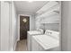 Bright laundry room, featuring washer, dryer, and ample shelving at 2002 Valnore Rd, Johns Island, SC 29455