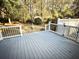 Large back deck with black metal railings and backyard access at 201 Center St, Walterboro, SC 29488