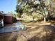 Spacious backyard with trees and a shed at 201 Center St, Walterboro, SC 29488
