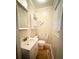 Small bathroom with white vanity and toilet at 201 Center St, Walterboro, SC 29488