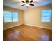 Bright bedroom with hardwood floors and ceiling fan at 201 Center St, Walterboro, SC 29488