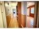 Hallway with built-in shelves and hardwood floors at 201 Center St, Walterboro, SC 29488