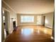 Living room with hardwood floors, fireplace, and lots of natural light at 201 Center St, Walterboro, SC 29488