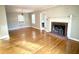 Living room with hardwood floors, fireplace, and lots of natural light at 201 Center St, Walterboro, SC 29488