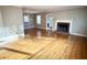 Living room with hardwood floors, fireplace, and lots of natural light at 201 Center St, Walterboro, SC 29488