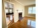 Living room with hardwood floors, fireplace, and access to other rooms at 201 Center St, Walterboro, SC 29488
