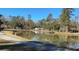 Peaceful pond with walking path and gazebo in a wooded area at 201 Center St, Walterboro, SC 29488