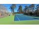 Two blue tennis courts with green surrounding area at 201 Center St, Walterboro, SC 29488