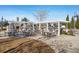Outdoor kitchen and dining area with brick grill, pergola, and seating at 218 River Martin Ct, Summerville, SC 29483
