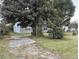 Gray house with a grassy yard and trees at 2351 Elegans Dr, North Charleston, SC 29405