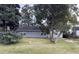 Gray house with a yard and trees at 2351 Elegans Dr, North Charleston, SC 29405