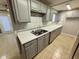 Kitchen with gray cabinets and marble countertops at 2351 Elegans Dr, North Charleston, SC 29405