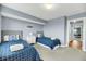 Twin bedroom with two beds, dresser and access to hallway at 2395 Folly Road Rd # 4F, Folly Beach, SC 29439