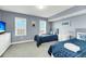 Twin bedroom with two beds, dresser and plenty of natural light at 2395 Folly Road Rd # 4F, Folly Beach, SC 29439