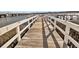 Long wooden dock stretching to the water at 2395 Folly Road Rd # 4F, Folly Beach, SC 29439