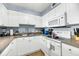 Well-equipped kitchen with white cabinets and appliances at 2395 Folly Road Rd # 4F, Folly Beach, SC 29439