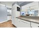 Modern kitchen features white cabinets, stainless steel appliances, and a breakfast bar at 2395 Folly Road Rd # 4F, Folly Beach, SC 29439