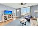 Living room with balcony access and water views at 2395 Folly Road Rd # 4F, Folly Beach, SC 29439
