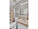 Clean bathroom features a shower/tub combo, updated vanity, and decorative wall at 250 W Medina St, Summerville, SC 29483