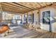 Covered porch with wooden ceiling, seating area, and grill at 250 W Medina St, Summerville, SC 29483